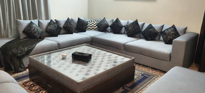 Branded L shaped Sofa set and 2 Mooras set in perfect conditions