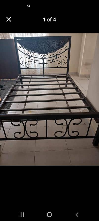 single iron rod bed