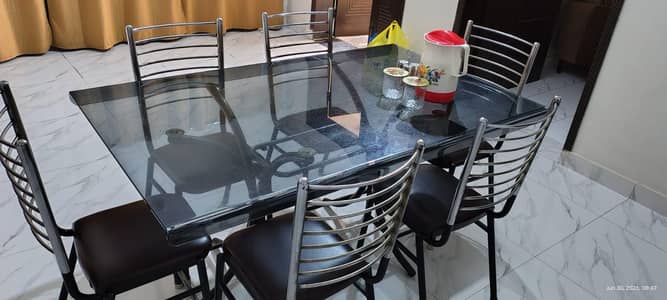 Tempered glass top dining table with 6 steel chairs