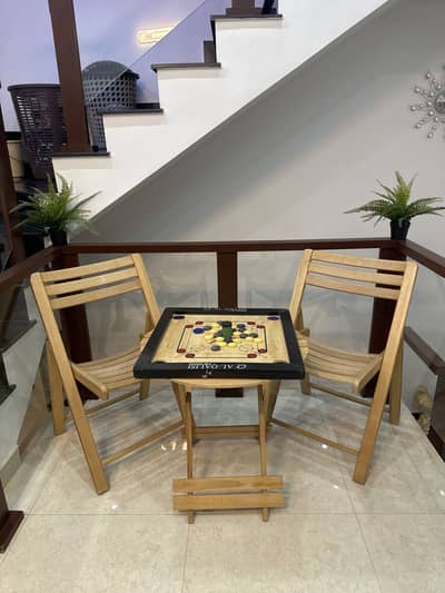 Table and chairs for sell with carrom board