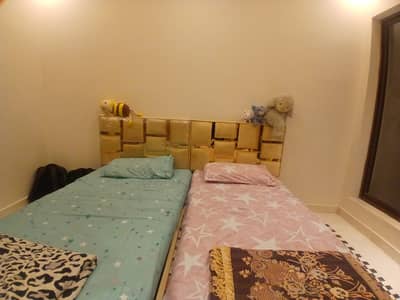 Two single beds without mattresses.