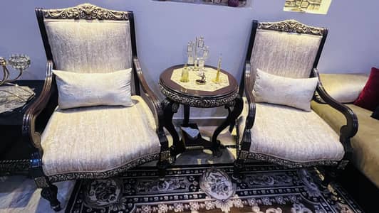 2 Single seater sofas chair with a round coffee table
