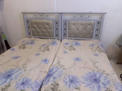 Two Single Beds with 2 Cupboards