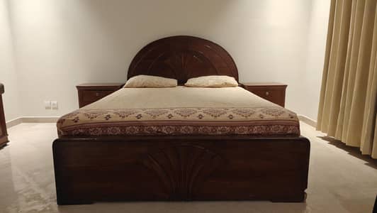 king size bed with side tables and dressing table
