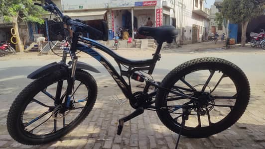 Plus bicycle with double shock absorber 7 gear