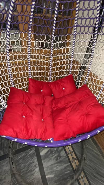 Swing with cushions