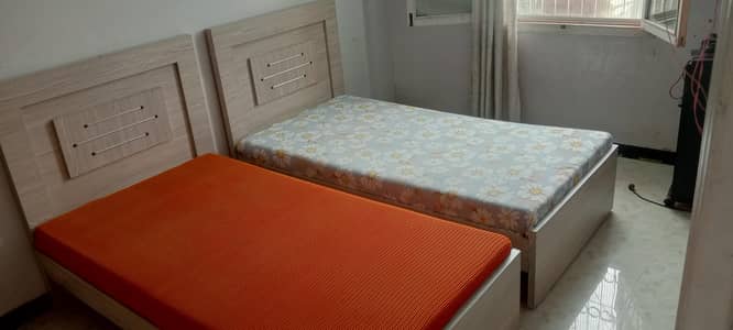 2 wooden single bed in good condition