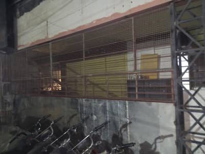 Shop outer grill complete with doors. 0/3/0/1/2/0/4/0/5/3/7.