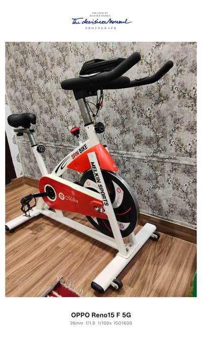Melkin Sports adjustable spin bike exercise cycle with digital display
