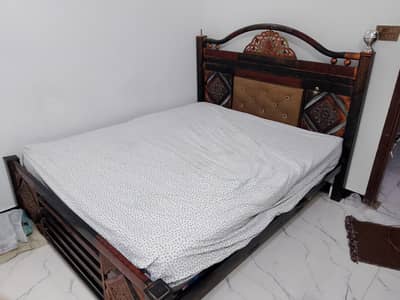 Title: Iron Bed with Spring Mattress – Good Condition