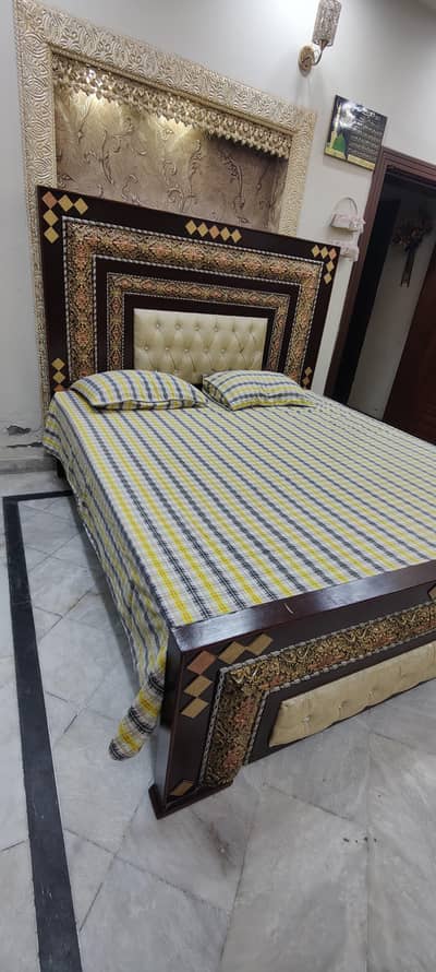 Bed with dressing and side tables . .