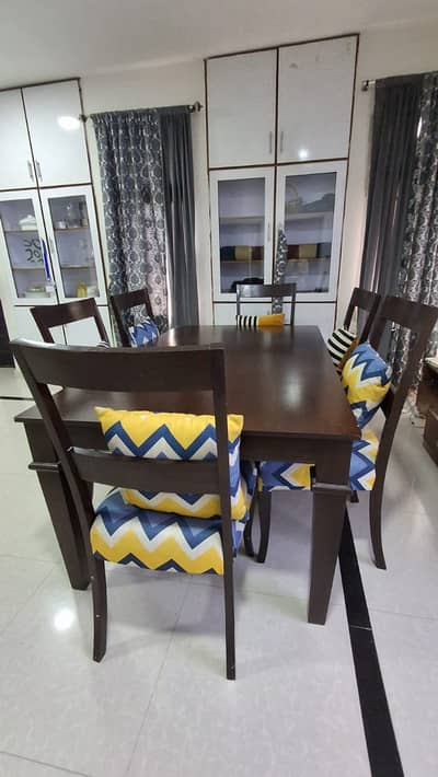 Dining table 6 seater. Hard wood and in perfect condition.