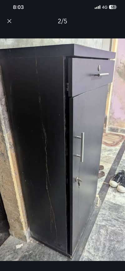 One door kid wardrobe black size 5 feet 9/10 condition hai.
