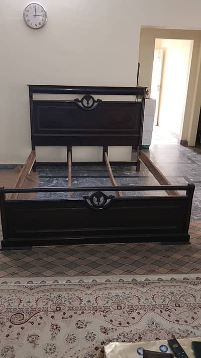 Wooden bed available for sale