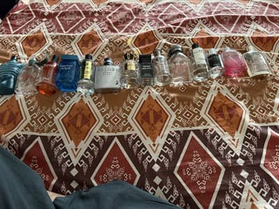 14 branded perfume empty bottles and 17 empty bottles Ahmed perfumes