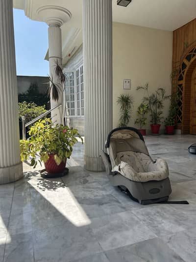 Baby cot cum car seat