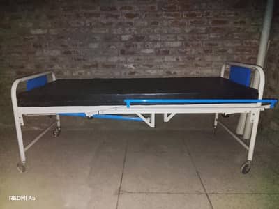wait and blue patient bed