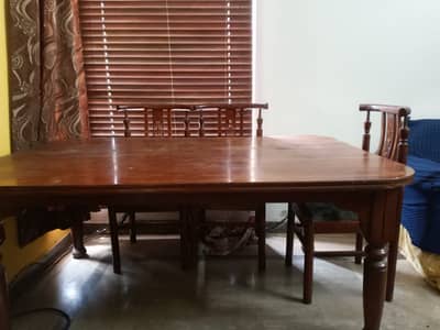 Wood table and 5 chairs good condtion .