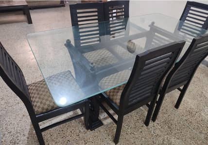 6 seater wooden dinning table with glass top