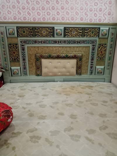 double bed with showcase and sofa
