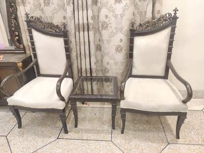 2 Chairs with a table and Dressing table.