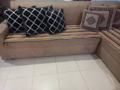 L shape sofa with cushions & two curtains
