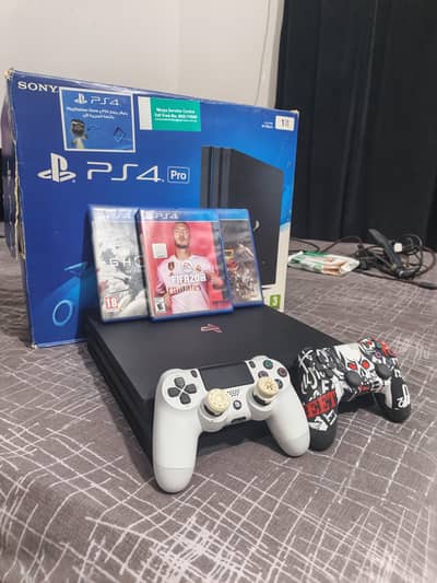 PS4 PRO 1TB WITH BOX GAMES AND CONTROLLERS FOR SALE