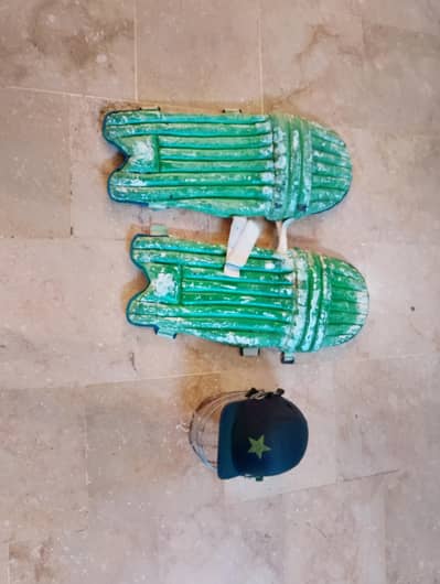cricket batting pads and batting helmet in good condition
