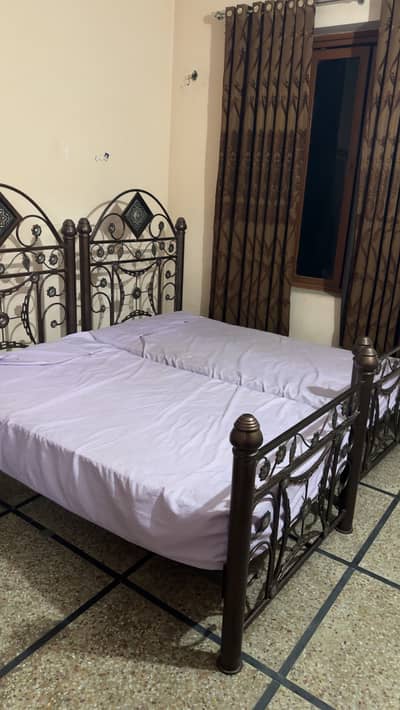 Iron bed with mattress and side table