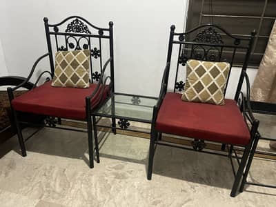 Single bed with side table And two chairs and center table