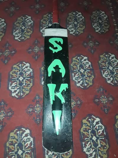 black COBRA SAKI SELL bat