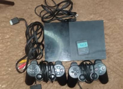 ps2 with 2 controllers and 8MB memory card
