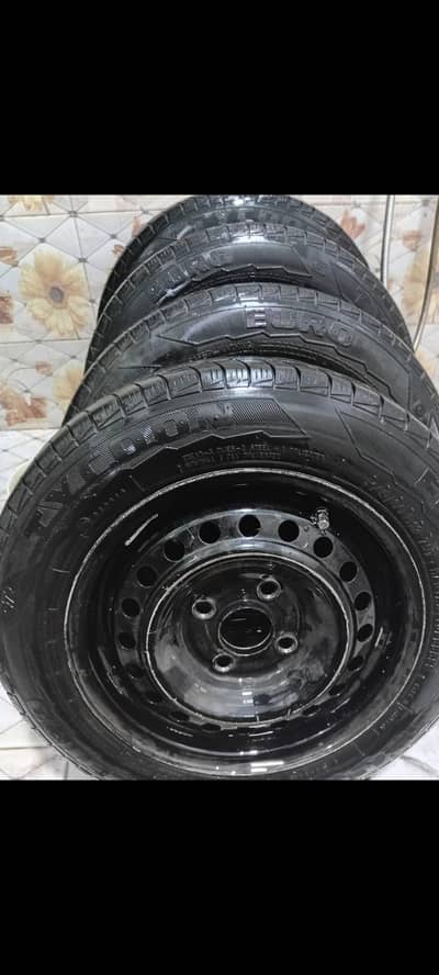 Japanese Rims 13 inch just like brand new along with used tyres, nuts