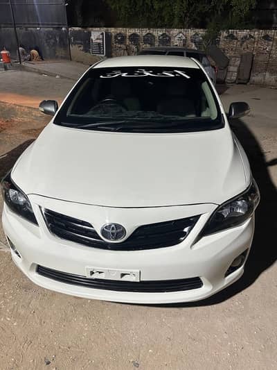 Corolla 2013 White XLI (GLI converted )