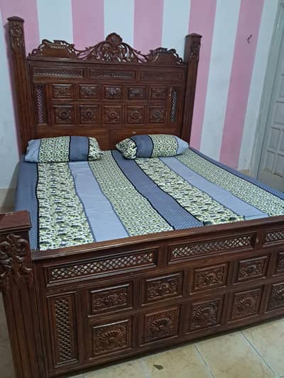 wooden king size bed  with side tables and dressing table