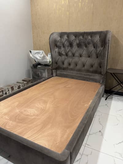 Single bed with one side table