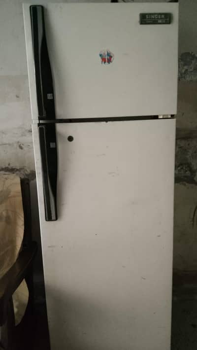 Medium sized refrigerator in good condition.