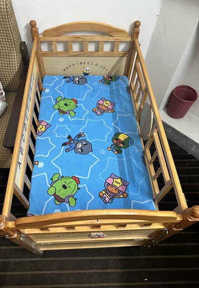 Wooden baby cot with mattress