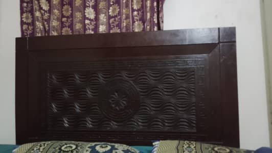 wooden bed with mattress