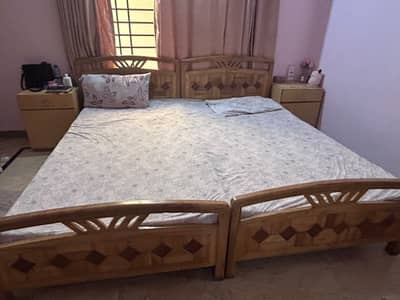 Two single beds with side table for sale