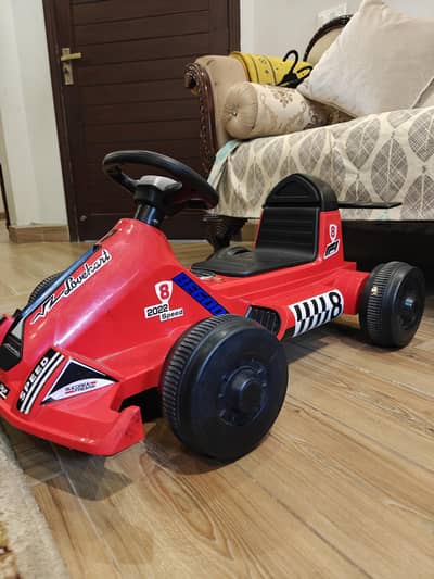 Kids Toy Car Ride-On racing car (excellent condition) 9.5/10