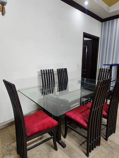 Stylish wooden dining table with six chairs