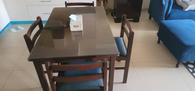 4-Seater Dining Table with 4 Chairs – Good Condition