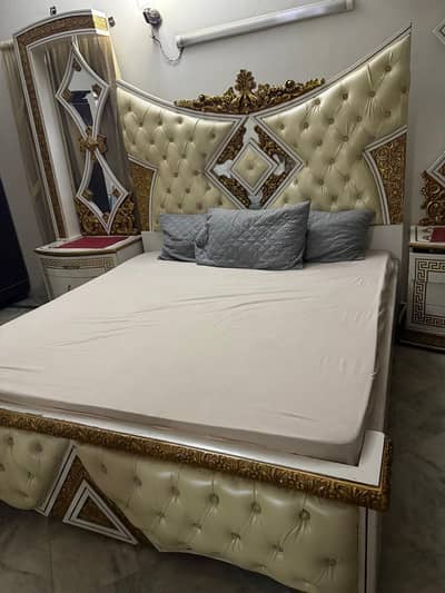 beautiful bed ,side tables and dressing