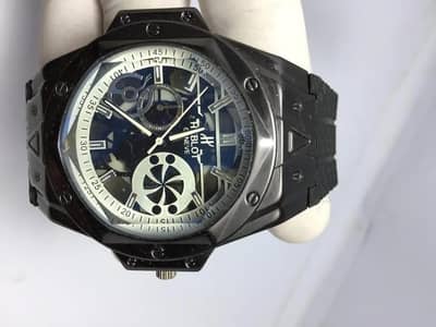 Man's black rubber strap skeletonized watch ⌚