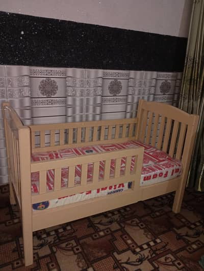 Wooden baby bed with mattress
