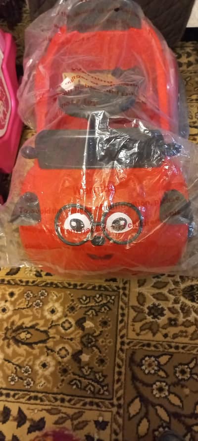 red electric car and pink manual