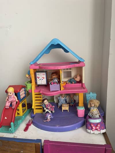 Doll house with furniture, dolls, toy slide, car .