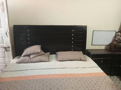 bed with side tables and dressing table without mattress