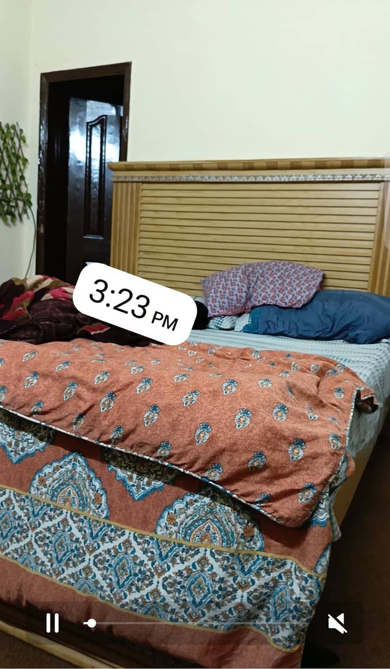 bed with two side tables. 0